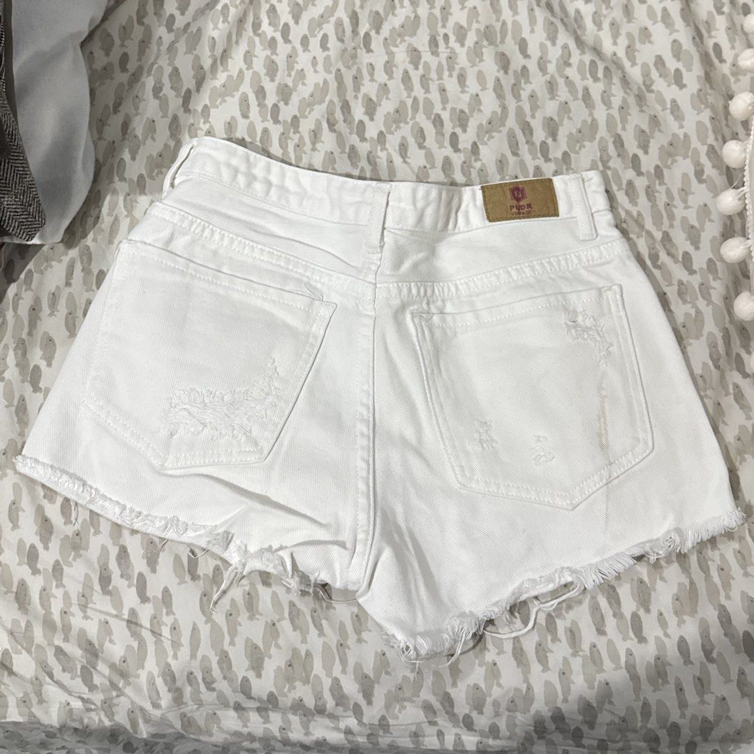 White Ripped Denim Shorts (Category: Shorts) located in Cebu City. Submitted by dianne.143 (Listing ID 1460128474, Image 2). Description: - High-waisted white denim shorts - Distressed rips and frayed hem - Button and zip closure - Classic five-pocket design - Ideal for casual wear - Versatile for pairing with any top.