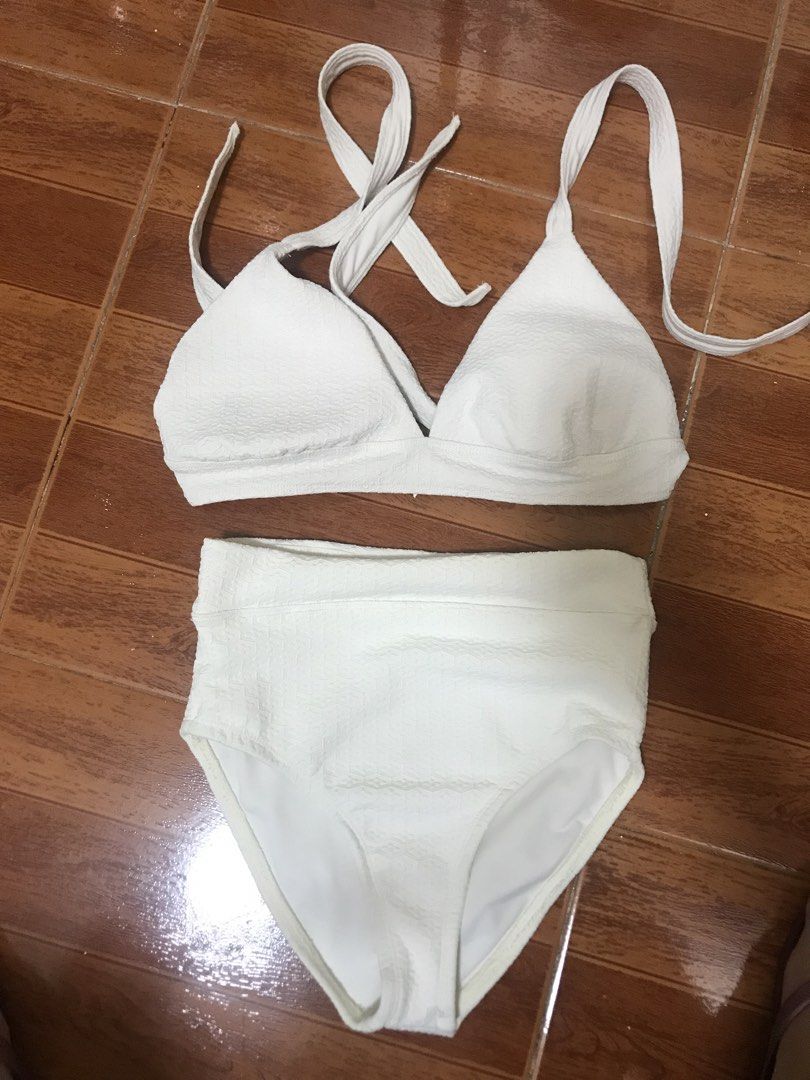 White Textured High Waisted Bikini (Category: Bikinis & Swimsuits) located in Manila. Submitted by airamef28.closet (Listing ID 1460263055, Image 1). Description: - White textured bikini set - High-waisted bottoms - Halter neck top with tie closure - Subtle honeycomb pattern material - Brand: Well Shop - Ideal for beach days and pool parties.