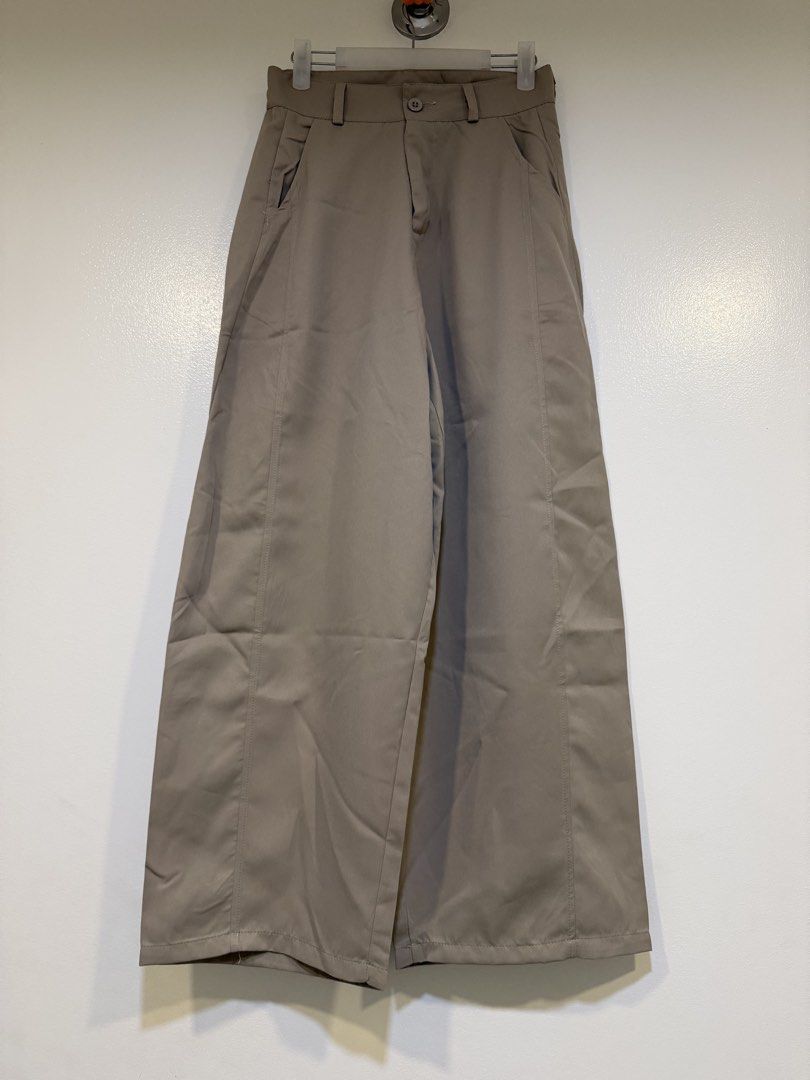 Wide Leg Pants Size S Beige (Category: Other Bottoms) located in Mandaluyong City. Submitted by closet.me (Listing ID 1460237042, Image 1). Description: - Beige wide leg pants - Size S - Button and zip closure - Front and back pockets - Versatile for casual or dressed-up outfits - Comfortable fit.