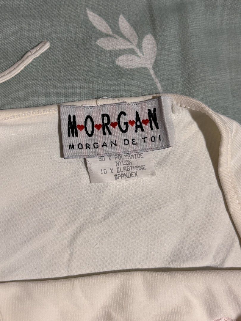 y2k beaded morgan de toi halter top (Category: Sleeveless) located in Quezon City. Submitted by kirsten.thrifts (Listing ID 1460284459, Image 3). Description: •has some yellowing and pink stains on the fabric, but it doesn’t affect the quality of the fabric •not sure if removable, hence the low price •size small-medium reminders before purchasing💞 - payment first/first to pay basis - no cancellation/return/refund of orders - prices are negotiabl
