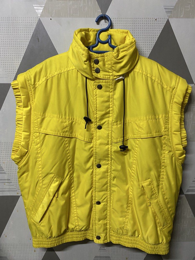 Yellow Puffer Vest with Collar (Category: Coats, Jackets and Outerwear) located in Quezon City. Submitted by natesm (Listing ID 1460208321, Image 1). Description: Exploration puffer vest free size never used Length: 32cm Width: 23cm.