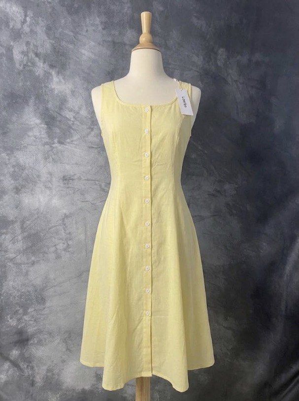 Yellow Sleeveless Button-Up Midi Dress (Category: Dresses) located in Balanga. Submitted by forevercloset.new (Listing ID 1460273804, Image 1). Description: - Adorable yellow midi dress - Sleeveless design - Button-up front closure - Chic square neckline - Versatile for casual or dressed-up occasions - Ideal for sunny summer days.