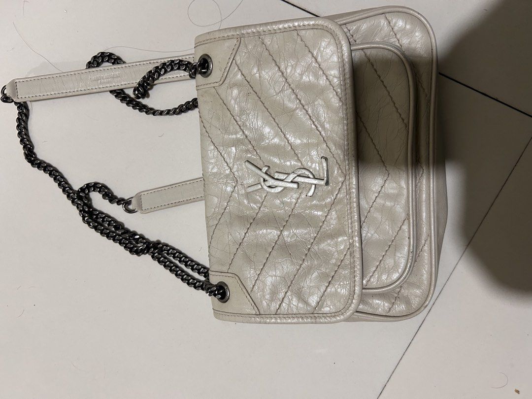 YSL Niki: Totally Loved (Category: Luxury Bags & Wallets) located in Cavite. Submitted by janinepalec (Listing ID 1460231339, Image 1). Description: This an Authentic YSL Niki Mini. It is well love some reasonable flaws on hardware and back of the leather (leather not that noticeable) 5000 fixed price .