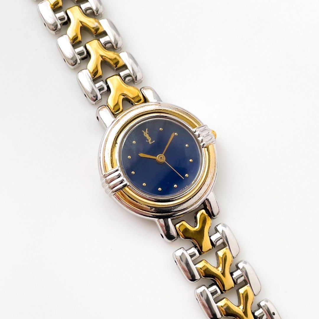 YSL watch (Category: Women's Watches) located in Manila. Submitted by milamarie (Listing ID 1460190206, Image 3). Description: A classic Yves Saint Laurent timepiece that blends elegance and sophistication. This vintage watch features a beautiful two-tone bracelet, a navy blue dial, gold-tone details, and the iconic YSL logo. A refined piece that adds a subtle touch of luxury to any look. DETAILS Brand:Yves Saint Laurent (YSL) Type:Ladies’ Watch 