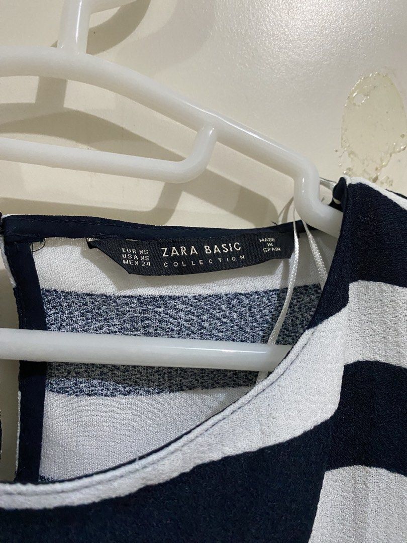 Zara Basic Striped Top with Pearl Button Details (Category: Blouses) located in Taguig. Submitted by maly01_ (Listing ID 1460209017, Image 3). Description: - navy and white striped top/blouse - flowy dm for inquiries :) .