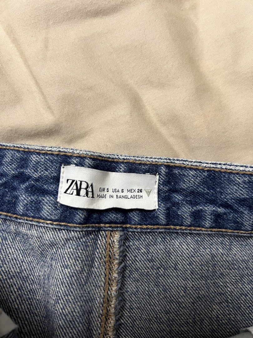 Zara Blue Denim Mini Skirt (Category: Skirts) located in Paranaque City. Submitted by dubaichocolei (Listing ID 1460195307, Image 3). Description: - Zara blue denim mini skirt - Classic five-pocket styling - Belt loops at the waist - Unique layered hem detail - Made in Bangladesh - Great for casual outfits.