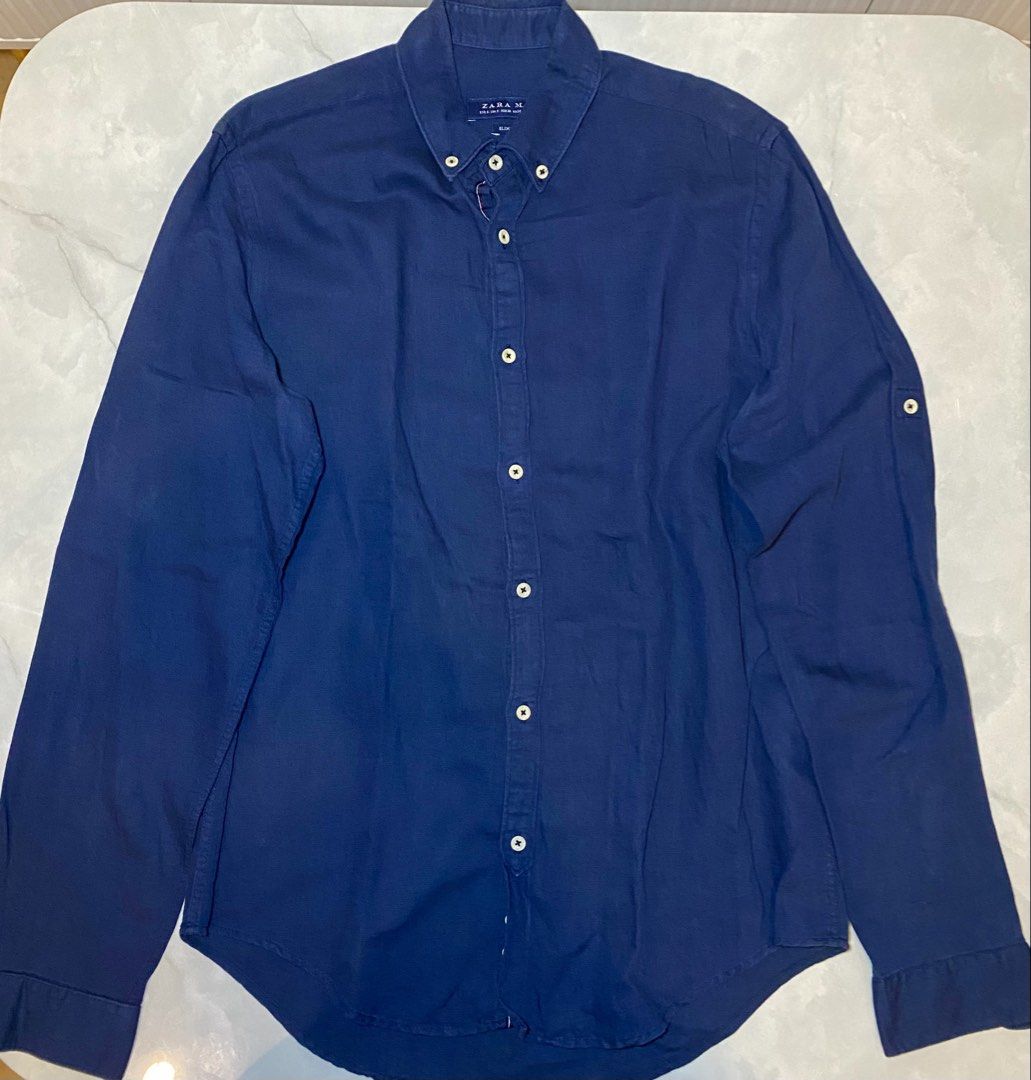 Zara Man Slim Fit Blue Button Down Shirt Size S (Category: Tshirts & Polo Shirts ) located in Manila. Submitted by sebthrift (Listing ID 1460129754, Image 1). Description: - Zara Man Blue Button-Down Shirt - Slim Fit Style - Classic Collar with Button-Down Detail - Made in Turkey - Versatile for Casual or Smart-Casual Wear - Easily Pairs with Jeans or Trousers.