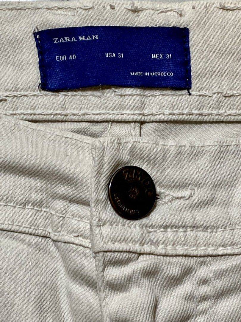 Zara Man White Denim Shorts Size 31 (Category: Shorts) located in Manila. Submitted by sebthrift (Listing ID 1460129803, Image 2). Description: - Zara Man White Denim Shorts - Size: 31 - Made in Morocco - Classic five-pocket design - Button and zip fly closure - Ideal for everyday casual wear.