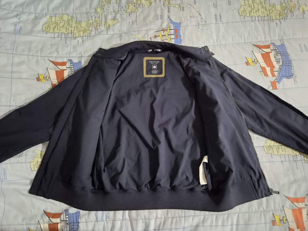 ZARA Traveler Bomber Jacket Navy Blue (Category: Coats, Jackets and Outerwear) located in Mandaluyong City. Submitted by countyannis-13843 (Listing ID 1460266440, Image 3). Description: - Zara Navy Blue Bomber Jacket - From the Traveler Collection - Zip-up front with a stand collar - Ribbed cuffs and hem for a snug fit - Two convenient side pockets - Fully lined interior - Ideal for layering over outfits.