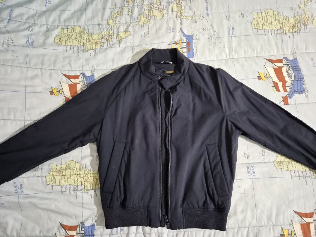 ZARA Traveler Bomber Jacket Navy Blue (Category: Coats, Jackets and Outerwear) located in Mandaluyong City. Submitted by countyannis-13843 (Listing ID 1460266440, Image 1). Description: - Zara Navy Blue Bomber Jacket - From the Traveler Collection - Zip-up front with a stand collar - Ribbed cuffs and hem for a snug fit - Two convenient side pockets - Fully lined interior - Ideal for layering over outfits.