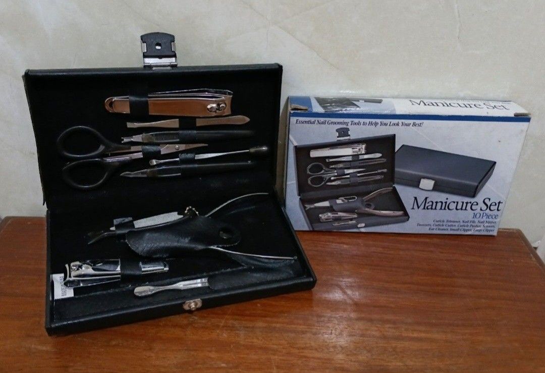 10-Piece Manicure & Pedicure Set With Case (Category: Hands & Nails) located in Bulacan. Submitted by honhonliz (Listing ID 1460354782, Image 1). Description: Only scissor & tweezer have stainless steel markings This personal grooming kit includes essential stainless steel tools securely organized inside a compact faux-leather travel case. Key tools include multiple sizes of nail clippers, a cuticle nipper, grooming scissors, tweezers, a nail fil