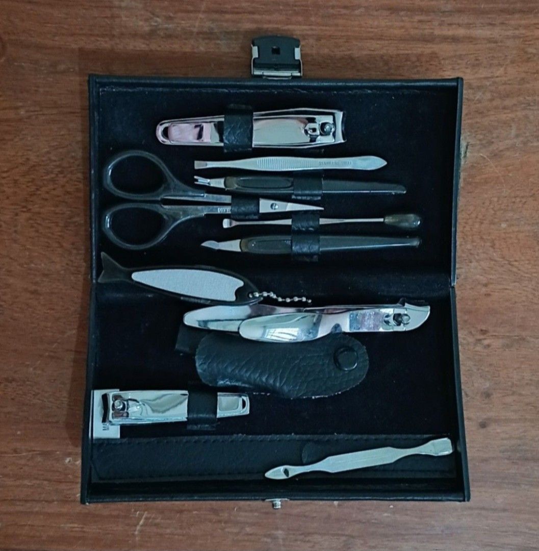 10-Piece Manicure & Pedicure Set With Case (Category: Hands & Nails) located in Bulacan. Submitted by honhonliz (Listing ID 1460354782, Image 2). Description: Only scissor & tweezer have stainless steel markings This personal grooming kit includes essential stainless steel tools securely organized inside a compact faux-leather travel case. Key tools include multiple sizes of nail clippers, a cuticle nipper, grooming scissors, tweezers, a nail fil