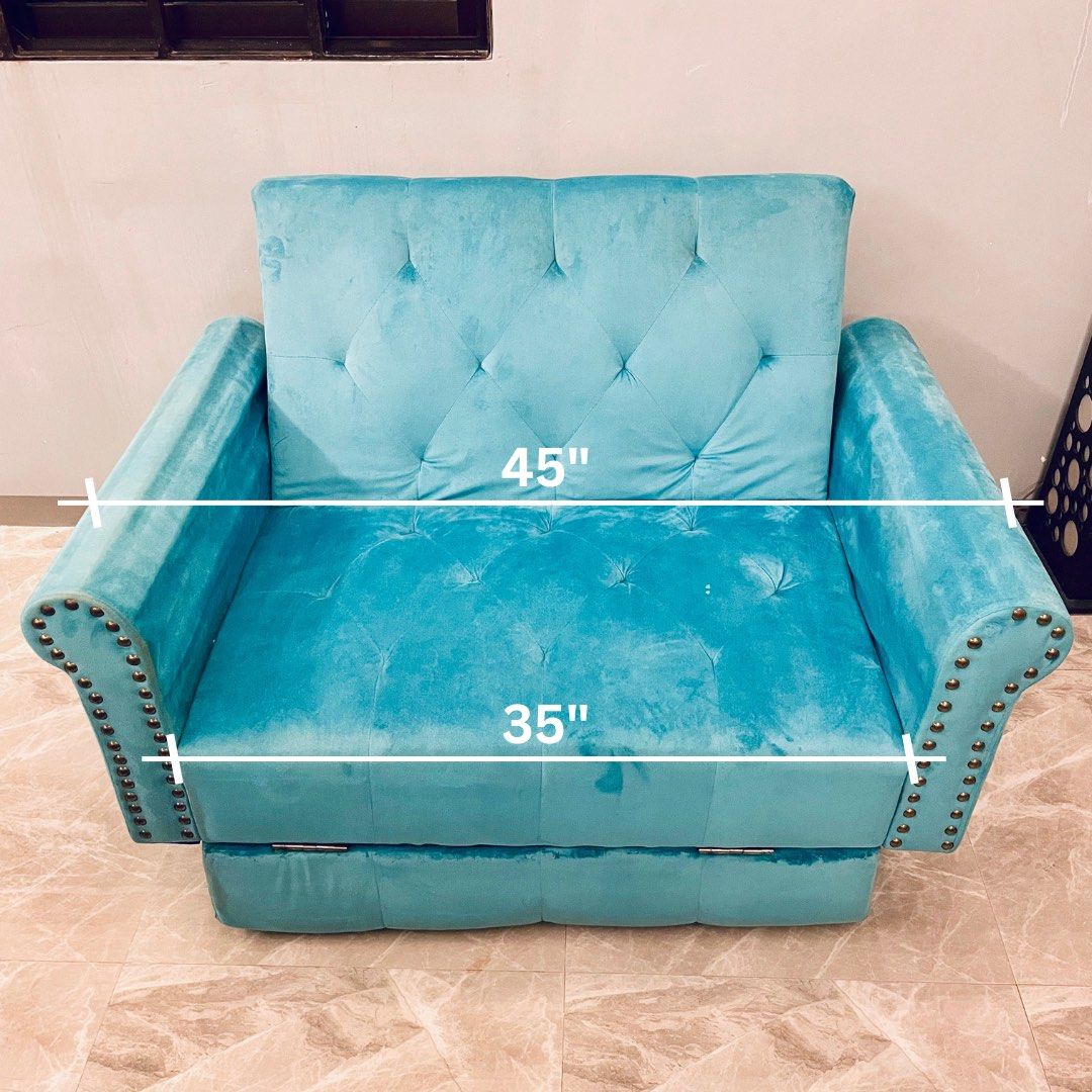 2-Seater Sofa Bed (Category: Sofas) located in Taguig. Submitted by boxheads (Listing ID 1459064680, Image 2). Description: 2-Seater Sofa Bed • Light blue velvet feel fabric • Tufted backrest and seat • Nailhead/stud detailing on armrests • Cute & cozy • Well used Negotiable but no lowballing please 🙏🏻 Issues/Condition: • Needs cleaning • Missing nailhead/stud • No legs Location: 📍Ususan, Taguig City Delivery: 🚐 Lalamove (buyer shoulders deli