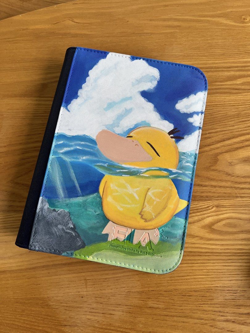 4-pocket Pokemon Psyduck Custom Painted Binder (Category: Other Stationery & Craft) located in Davao. Submitted by sayiestudios (Listing ID 1460503754, Image 2). Description: - Adorable Psyduck TCG binder - Features a vibrant illustration of Psyduck swimming - Solid blue back - Ideal for storing small items (cards, accessories, etc.) - Keeps belongings organized in style - A must-have for any Pokemon fan - ELA BRAND.
