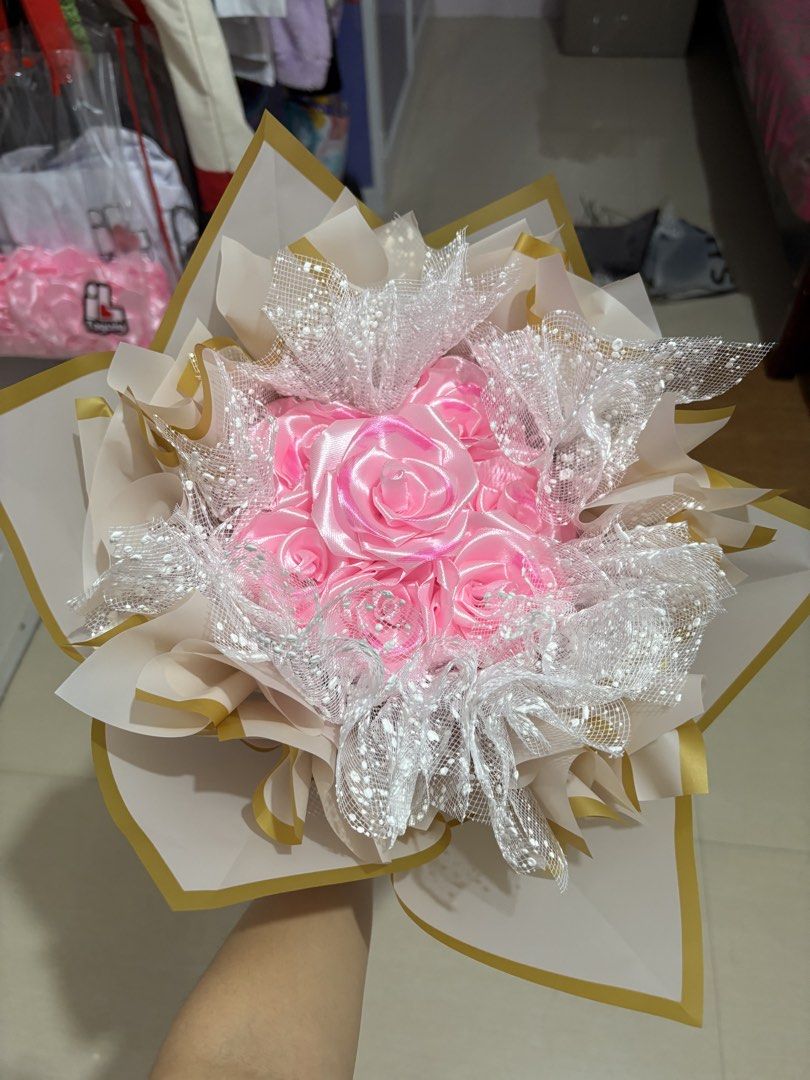 7 count pink satin flower bouquet (Category: Flowers & Bouquets) located in Taguig. Submitted by riverphoenix24 (Listing ID 1460349971, Image 1). Description: Can also make custom bouquets.