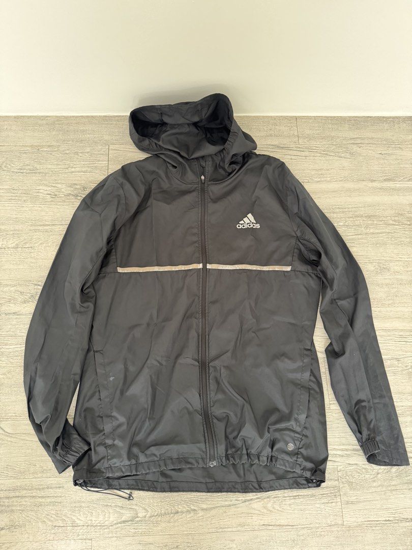 Adidas Black Windbreaker — fading silver detail (Category: Coats, Jackets and Outerwear) located in Manila. Submitted by celestial08 (Listing ID 1460445403, Image 2). Description: Well used but still wearable and functional. The silver detailing/line has visible fading from use. Please see photos for the actual condition. Selling as-is..