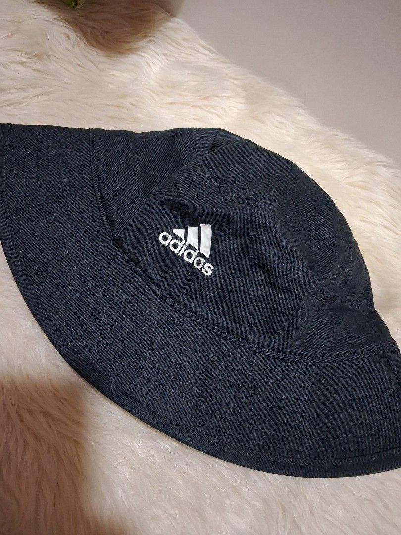 ADIDAS BUCKET HAT NEGOTIABLE (Category: Caps & Hats) located in Quezon City. Submitted by jiejieph (Listing ID 1460367360, Image 1). Description: - Classic black Adidas bucket hat - Made from 100% cotton - Iconic Adidas logo on the front - Ideal for sunny days and adding a sporty vibe - Easy to pack and wear anywhere - Simple and stylish design.