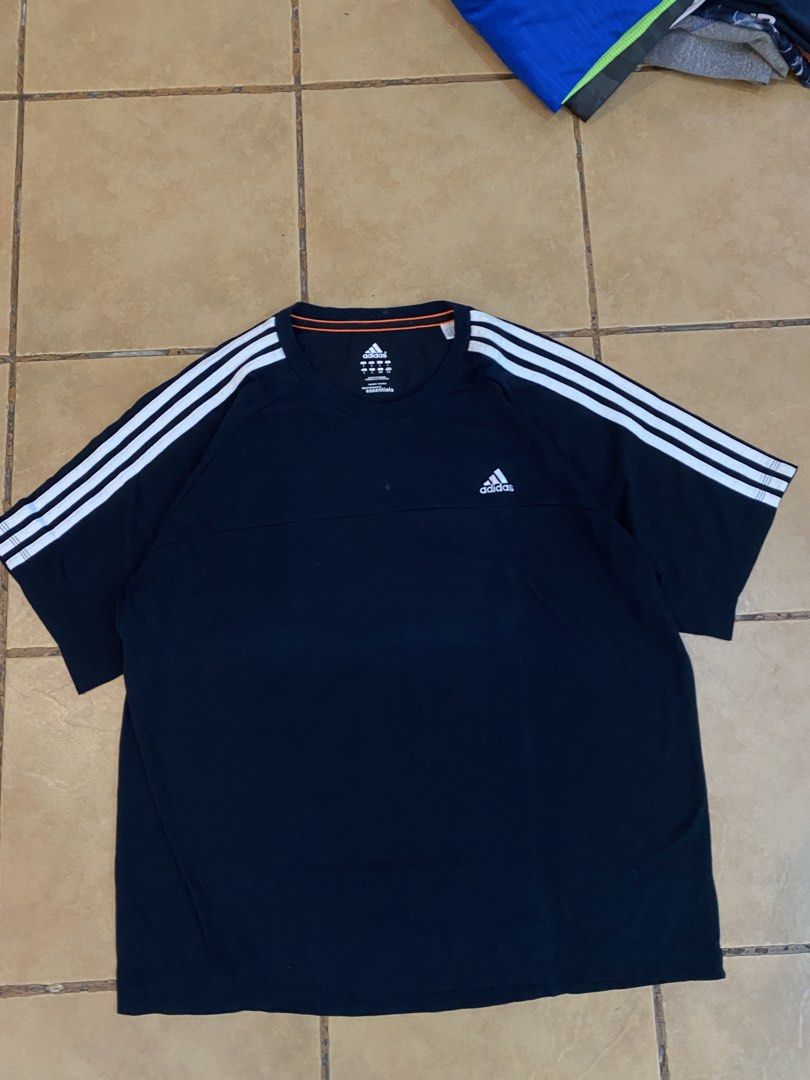 Adidas Performance Essentials Black T-Shirt (Category: Tshirts & Polo Shirts ) located in Manila. Submitted by sebthrift (Listing ID 1460370586, Image 1). Description: - Black Adidas T-shirt - White stripes on sleeves - Adidas logo on chest - Made in Cambodia - Size L (fits like 2XL) - Ideal for sports or casual wear.