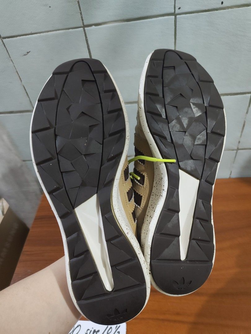 Adidas SL Loop Size 10.5 (Category: Sneakers) located in Cavite. Submitted by avbcortes (Listing ID 1460309703, Image 2). Description: - Adidas SL Loop Shoes - Size: 10.5 - Colorway: Beige and Brown with bright Yellow Laces - Condition: Shows some wear and tear on toe box and sides (consistent with use) - Ideal for: Casual wear.