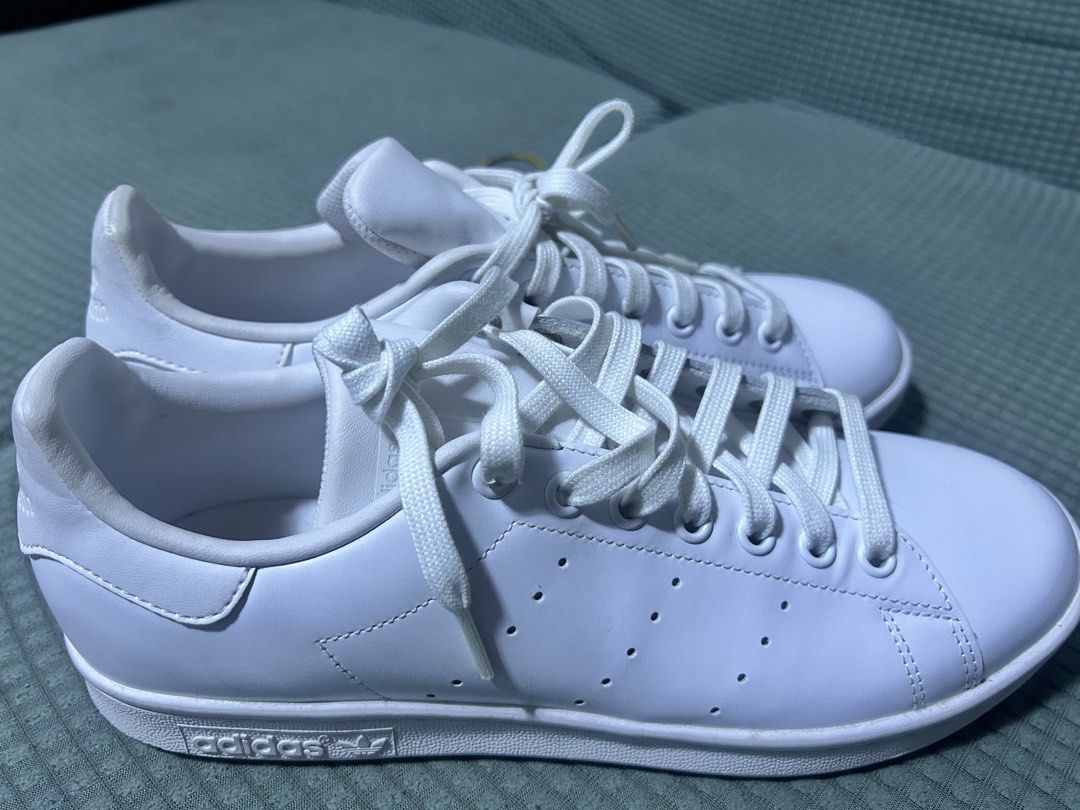 Adidas Stan Smith White Leather Sneakers (Category: Sneakers) located in Pasig City. Submitted by acirecruz (Listing ID 1460498058, Image 2). Description: - Classic white Adidas Stan Smith sneakers - Iconic leather version - Made in Vietnam - Size: 8 US / 7.5 UK - Clean and simple design - Great for everyday wear - New, never pang nagamit sa labas - Bought sa mismong adidas website - may box na kasama, hindi lang nasama sa picture 5,500 original 