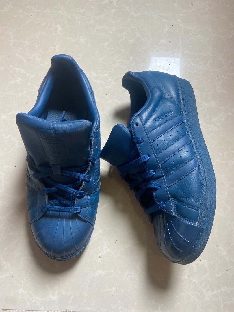 Adidas Superstar Blue Leather Sneakers (Category: Casual Shoes) located in Manila. Submitted by lilsintenel (Listing ID 1460420824, Image 1). Description: - Authentic Adidas Superstar sneakers - Color: Blue - Material: Leather - Size: UK 6 / US 7.5 / EU 39.5 - Style: Classic, perfect for casual wear - Condition: Good, with some signs of wear (please check photos for details).