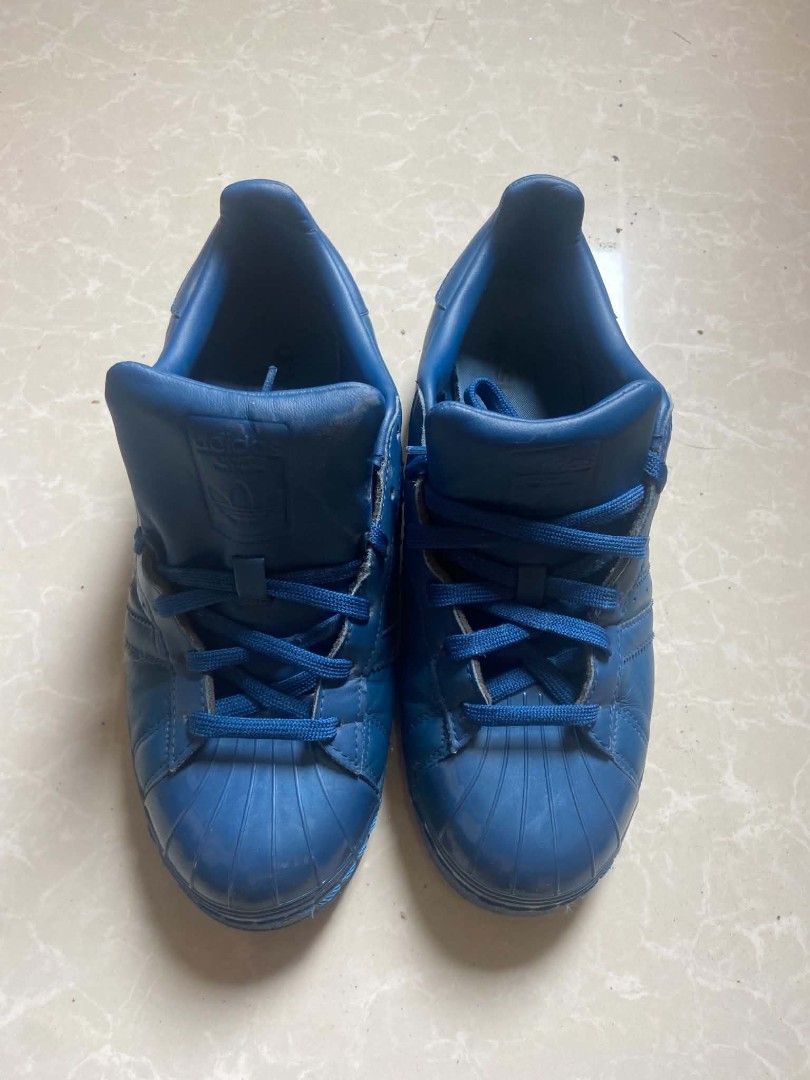 Adidas Superstar Blue Leather Sneakers (Category: Casual Shoes) located in Manila. Submitted by lilsintenel (Listing ID 1460420824, Image 2). Description: - Authentic Adidas Superstar sneakers - Color: Blue - Material: Leather - Size: UK 6 / US 7.5 / EU 39.5 - Style: Classic, perfect for casual wear - Condition: Good, with some signs of wear (please check photos for details).