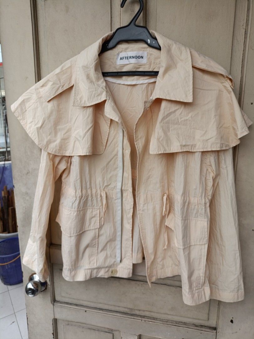 AFTERNOON LIGHTWEIGHT JACKET (Category: Coats, Jackets and Outerwear) located in Quezon City. Submitted by collectandselect (Listing ID 1460417204, Image 2). Description: - Lightweight beige jacket from AFTERNOON - Made in Korea - Free size - Drawstring waist for adjustable fit - Two front pockets - Unique cape-like collar detail - Great for layering - Perfect for cooler days.