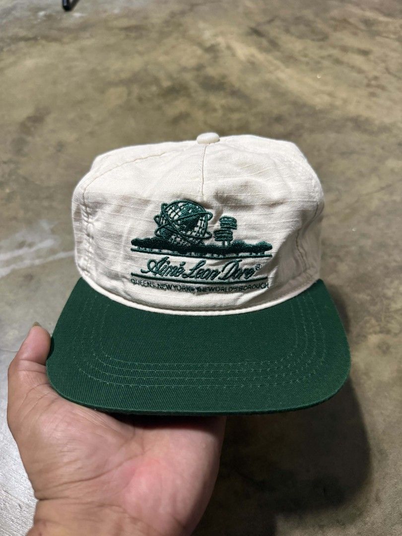 Aime Leon Dore Queens New York Baseball Cap (Category: Caps & Hats) located in Manila. Submitted by thriftyboyzzz (Listing ID 1460468706, Image 1). Description: - Brand: Aime Leon Dore - Design: Queens New York logo embroidery - Color: Cream crown with green brim - Closure: Adjustable snapback - Style: Ideal for casual wear.