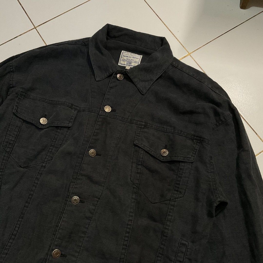 American Report Black Denim Jacket (Category: Coats, Jackets and Outerwear) located in Morong. Submitted by rusty.vault (Listing ID 1460457155, Image 3). Description: - Brand: American Report - Color: Black - Style: Classic Trucker Denim Jacket - Closure: Button-down - Pockets: Two chest pockets - Details: Frayed hem on sleeves - Occasion: Casual wear - Issue Hem W: 24 inch L: 24 inch Sleeve: 23 inch.