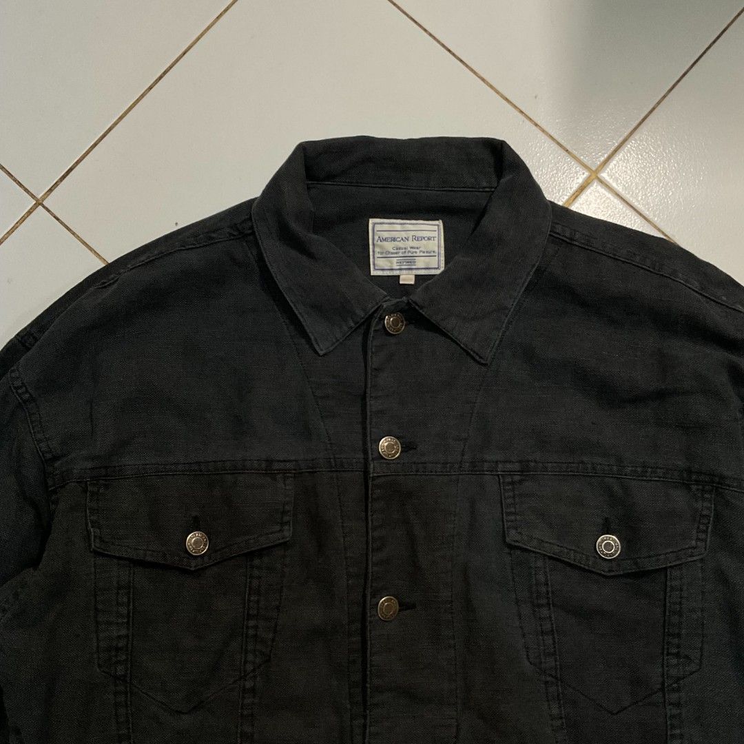 American Report Black Denim Jacket (Category: Coats, Jackets and Outerwear) located in Morong. Submitted by rusty.vault (Listing ID 1460457155, Image 2). Description: - Brand: American Report - Color: Black - Style: Classic Trucker Denim Jacket - Closure: Button-down - Pockets: Two chest pockets - Details: Frayed hem on sleeves - Occasion: Casual wear - Issue Hem W: 24 inch L: 24 inch Sleeve: 23 inch.