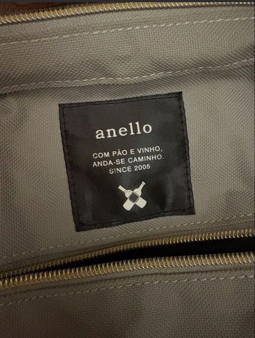 Anello Backpack Grey Canvas (Category: Backpacks) located in Manila. Submitted by z.finds (Listing ID 1460372675, Image 2). Description: - Grey Anello canvas backpack - Versatile carrying options: top handles and adjustable shoulder strap - Convenient front zipper pocket for quick access - Spacious interior, perfect for daily use - Interior label reads: 'anello COM PÃO E VINHO, ANDA-SE CAMINHO. SINCE 2005'.