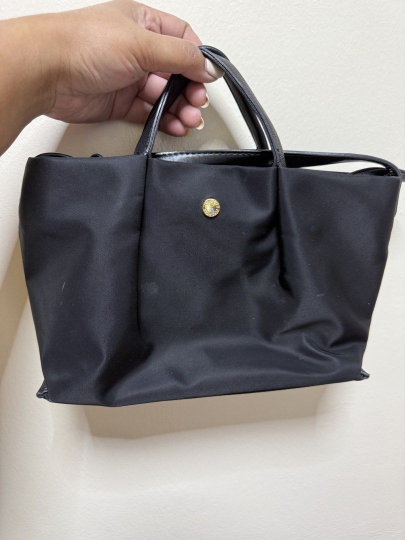 Angelic Pretty Tote Bag - Black (Category: Tote Bags) located in Quezon City. Submitted by samutsariatpb (Listing ID 1460446521, Image 2). Description: - Brand: Legato Mini Sling Bag from Japan - Type: Black Mini Sling Bag 💯% authentic - Details: Gold button on front, shiny black handles - Condition: Comes with tags and original packaging - Use: Ideal for everyday carry.