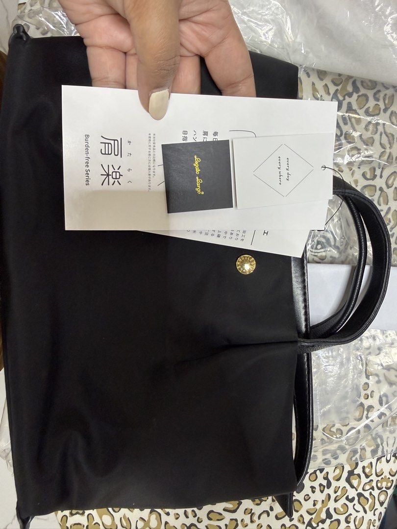 Angelic Pretty Tote Bag - Black (Category: Tote Bags) located in Quezon City. Submitted by samutsariatpb (Listing ID 1460446521, Image 1). Description: - Brand: Legato Mini Sling Bag from Japan - Type: Black Mini Sling Bag 💯% authentic - Details: Gold button on front, shiny black handles - Condition: Comes with tags and original packaging - Use: Ideal for everyday carry.