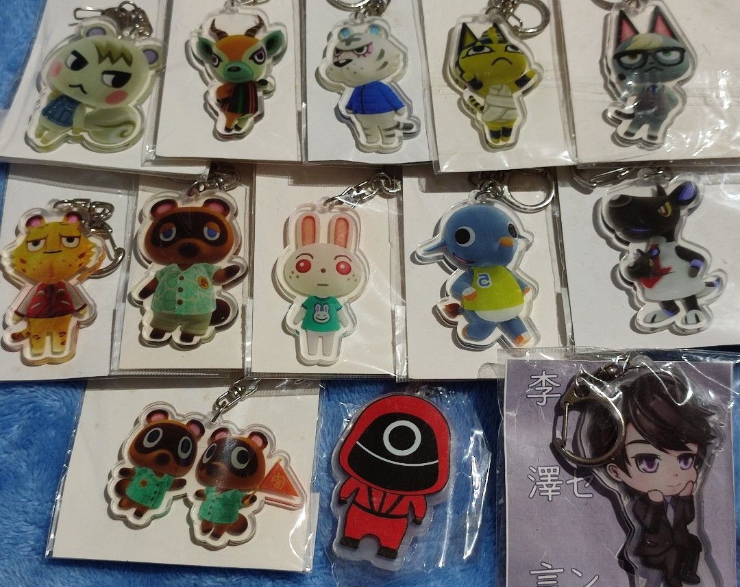 Animal Crossing & Squid Game Acrylic Keychains - P35 Each (Category: Character Goods) located in Baguio. Submitted by abigailmyra (Listing ID 1460331530, Image 3). Description: - Cute acrylic keychains featuring characters from Animal Crossing and Squid Game. - Perfect accessory for your bags or keys. - Available for only P35 each loc:Baguio-CAR.