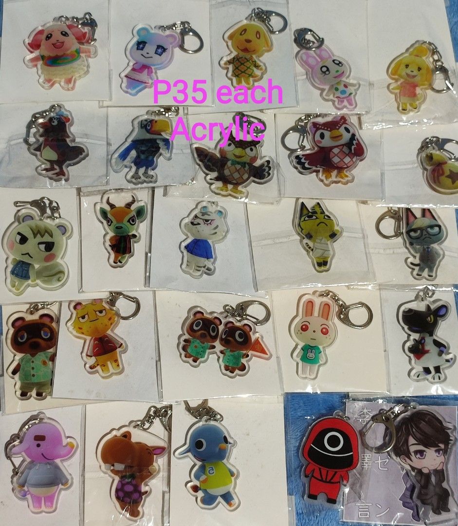 Animal Crossing & Squid Game Acrylic Keychains - P35 Each (Category: Character Goods) located in Baguio. Submitted by abigailmyra (Listing ID 1460331530, Image 1). Description: - Cute acrylic keychains featuring characters from Animal Crossing and Squid Game. - Perfect accessory for your bags or keys. - Available for only P35 each loc:Baguio-CAR.