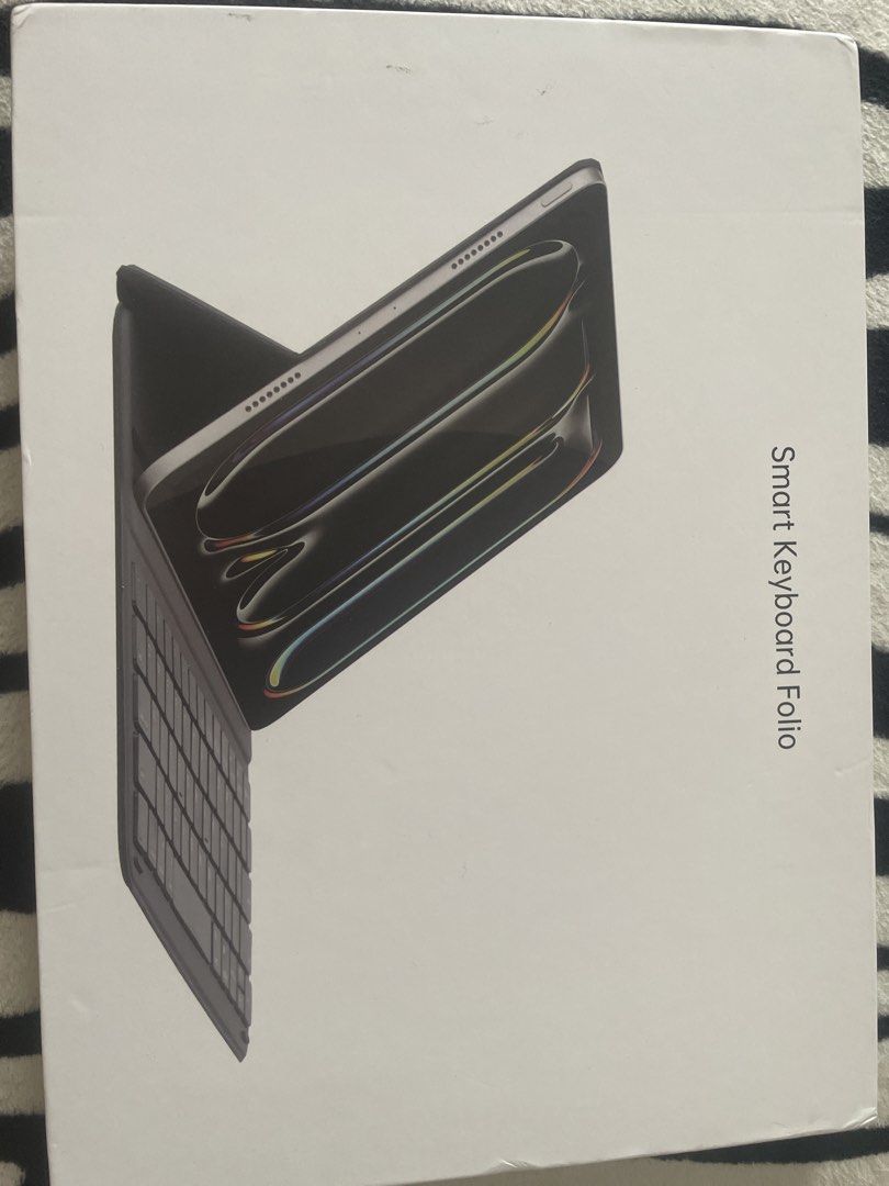 Apple Smart Folio for iPad Air 11-inch (M2) (Category: Cases & Sleeves) located in Pasay City. Submitted by tropak_mo (Listing ID 1460369897, Image 1). Description: - Smart Keyboard Folio in Grey - Features a built-in battery - Adjustable stand for comfortable viewing - Slim and portable design for on-the-go use - Ideal for typing anywhere The Smart Folio for iPad Air (M2) supports a wider range of viewing angles for reading, watching movies, typ