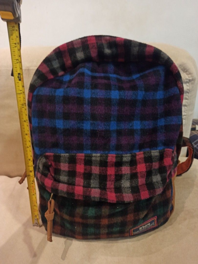 Arbore Plaid Flannel Backpack mixed color design (Category: Backpacks) located in Caloocan City. Submitted by rtarellano (Listing ID 1460434388, Image 1). Description: - Stylish plaid flannel backpack in blue, red, purple, and green checks. - Accented with durable brown leather details and straps. - Bright and fun orange interior lining. - Ideal for everyday adventures or your next getaway..