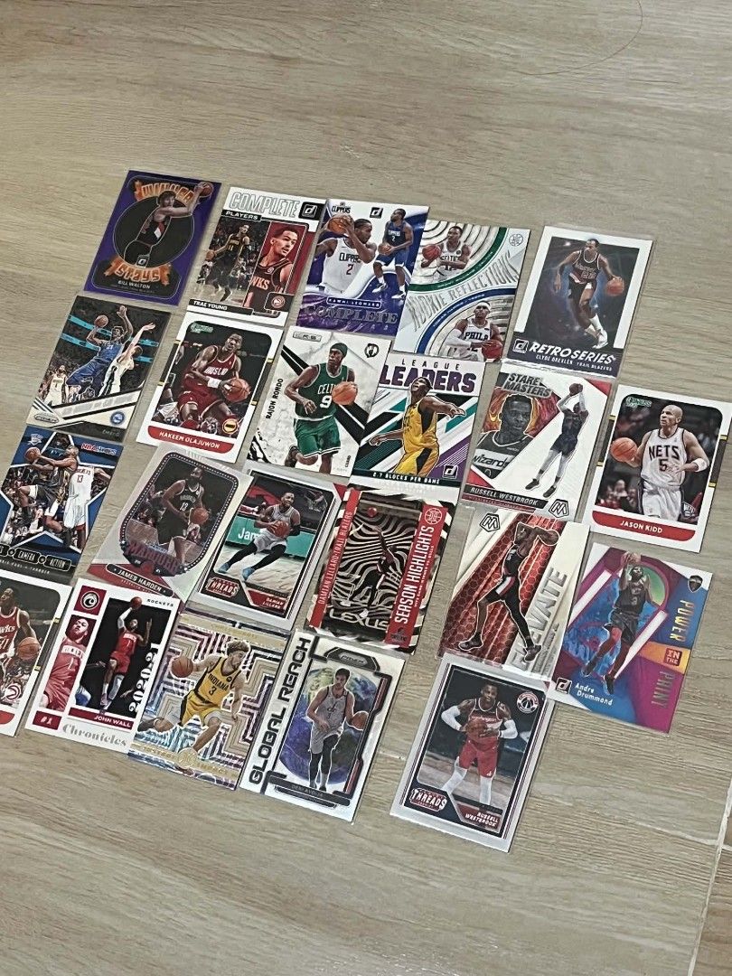 Assorted NBA Basketball Trading Cards Collection (Category: Raw Singles) located in Pasig City. Submitted by ace08sarcastic (Listing ID 1460394652, Image 1). Description: Selling a collection of NBA basketball trading cards. Features various players like Trae Young, Hakeem Olajuwon, Rajon Rondo, and James Harden. Includes cards from different sets like Chronicles, Donruss, and more. Great for collectors. All cards are shown in the photos..