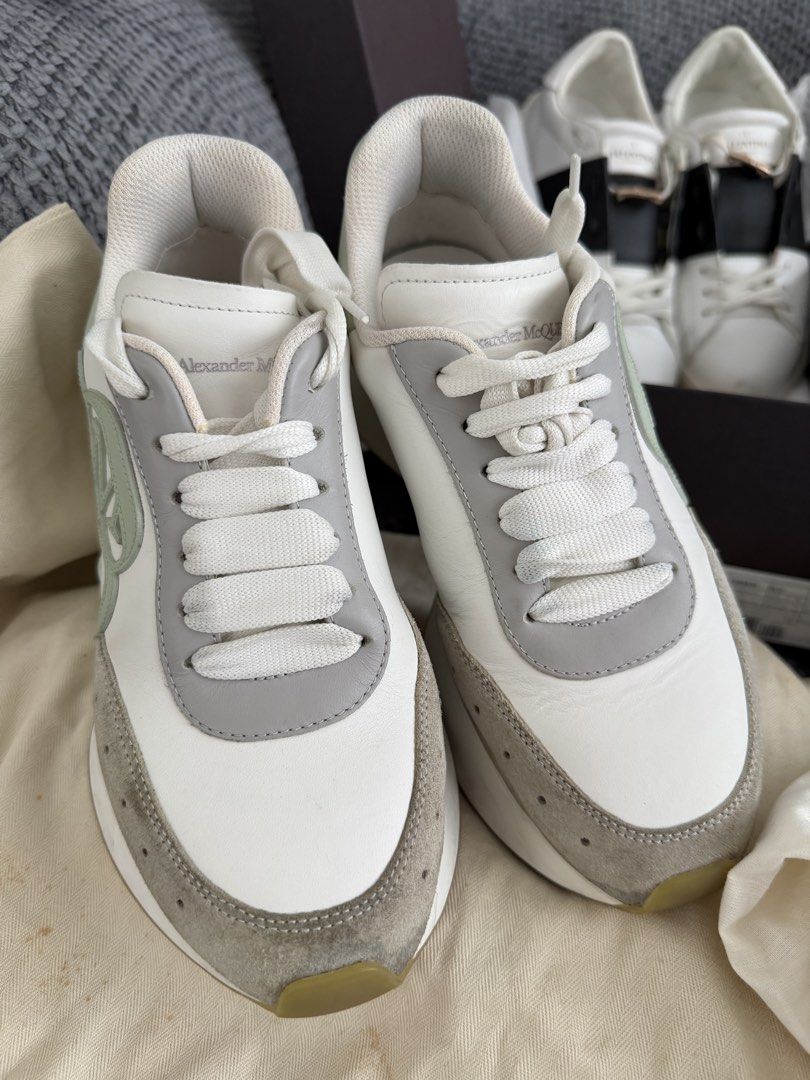 Authentic Alexander McQueen Oversized Sneaker White Sage Green (Category: Sneakers) located in Taguig. Submitted by claire08hyun (Listing ID 1460363674, Image 2). Description: - Authentic Alexander McQueen sneakers - Color: White with Sage Green accents - Design: Chunky sole, lace-up closure - Perfect for: Casual wear - Includes: Original dust bag - Condition: Please check photos for detailed condition.