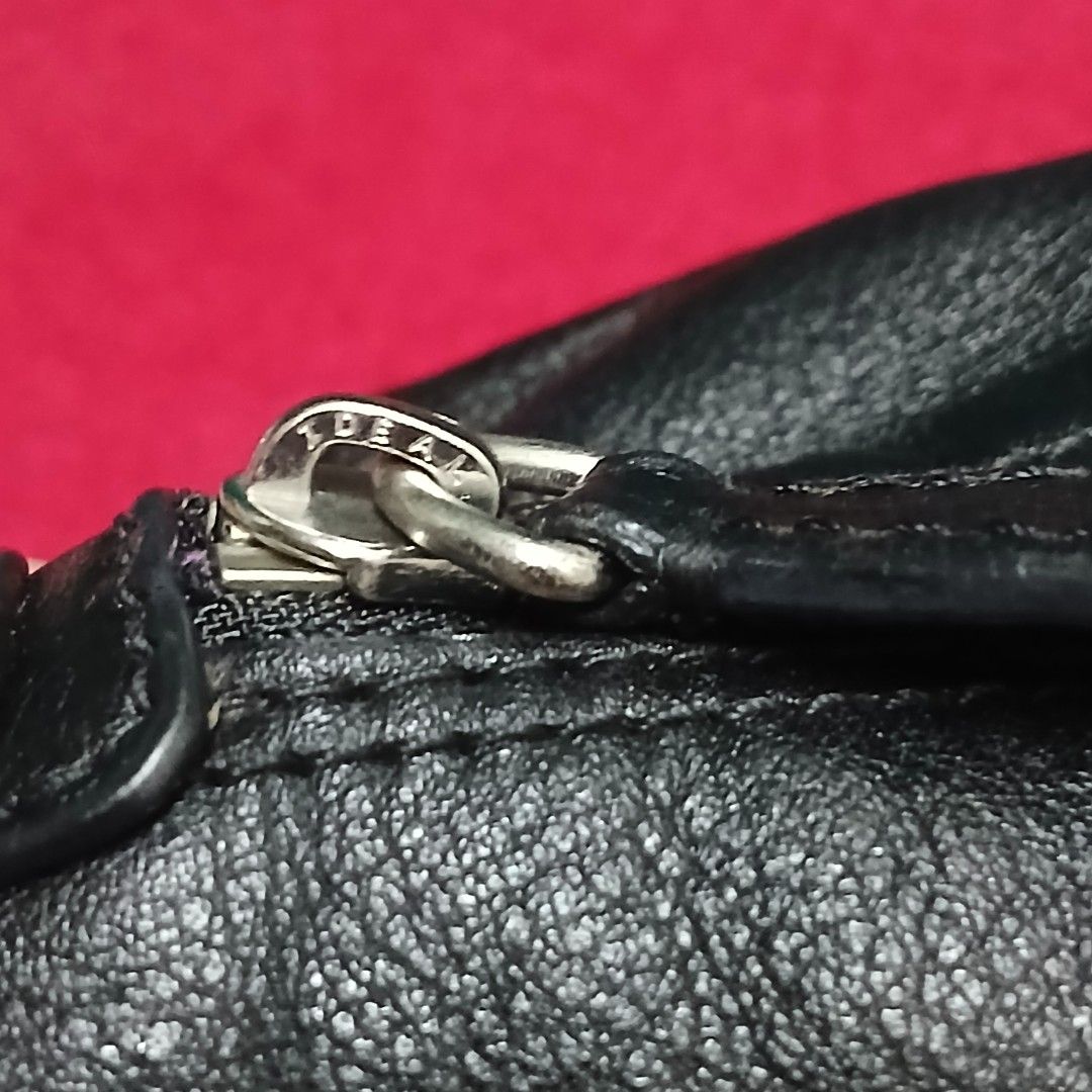 Coach Leather Satchel Bag (Category: Purses & Pouches) located in Cagayan de Oro. Submitted by susanthrifts (Listing ID 1460447945, Image 3). Description: ​Brand & Model: Coach (Serial No. D1275-F18445) ​Material: Black full-grain cowhide leather with purple satin interior ​Hardware: Silver-tone hardware with original leather hangtag and IDEAL zippers ​Condition: Pre-loved; leather and exterior in great shape, minor inner lining stains from norma