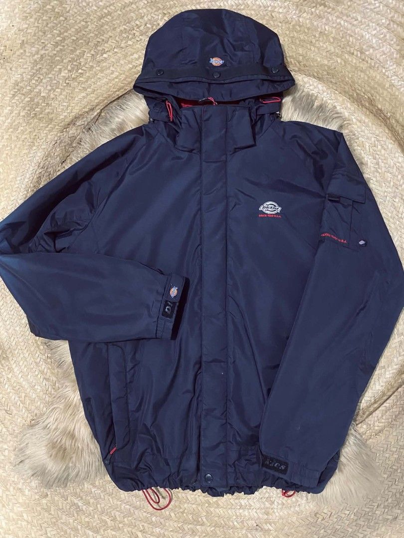 Authentic Dickies Technical Utility Jacket (Category: Coats, Jackets and Outerwear) located in Manila. Submitted by jctclthng_2026 (Listing ID 1460421471, Image 1). Description: Size: Men's XL (Laid flat: Width/Pit-to-Pit: ~25 inches | Length: ~30 inches) Color: Solid Jet Black with clean red logo accents Material: Premium Water Repellent, Breathable inner lining Features: -2 zip hand pockets, 1 tactical left sleeve pocket -Full double-zipper, fr