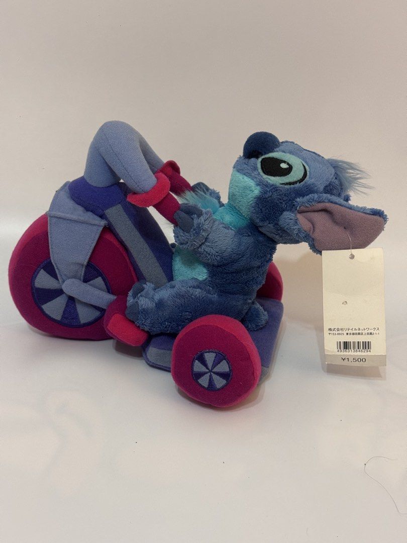 Authentic Disney Store Stitch on Tricycle Plush (Category: Plushies & Soft Toys) located in Antipolo. Submitted by bhabiegraciefashionlab (Listing ID 1460506079, Image 1). Description: Selling an authentic Disney Store Stitch on Tricycle plush in excellent, brand-new condition with the original tag still attached! Character: Stitch (from Lilo & Stitch)Features: Stitch is riding a colorful plush tricycle (blue, purple, and bright pink). Condition: