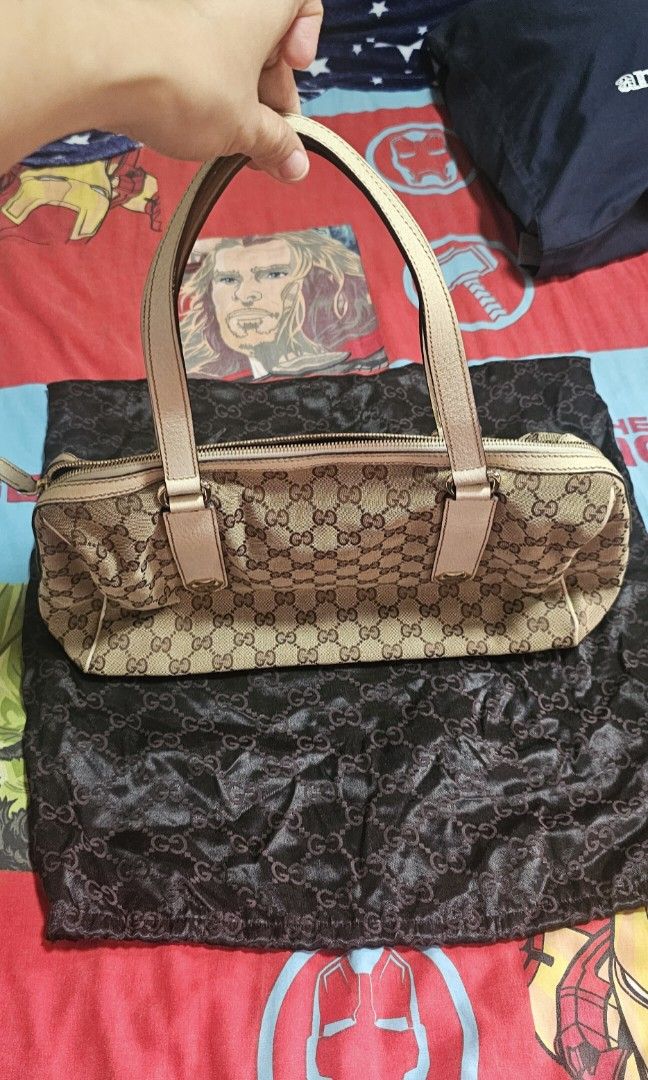 Authentic Gucci GG Canvas Shoulder bag (Category: Luxury Bags & Wallets) located in Manila. Submitted by fanta0923 (Listing ID 1460327317, Image 1). Description: ✨ Authentic Gucci GG Canvas Shoulder Bag — Beige/White ✨ Classic vintage Gucci satchel — retired style, timeless design. GG monogram canvas with white leather trim, silver stud hardware, top zip closure. Good condition — canvas clean, leather supple, interior fresh. Serial number intact 