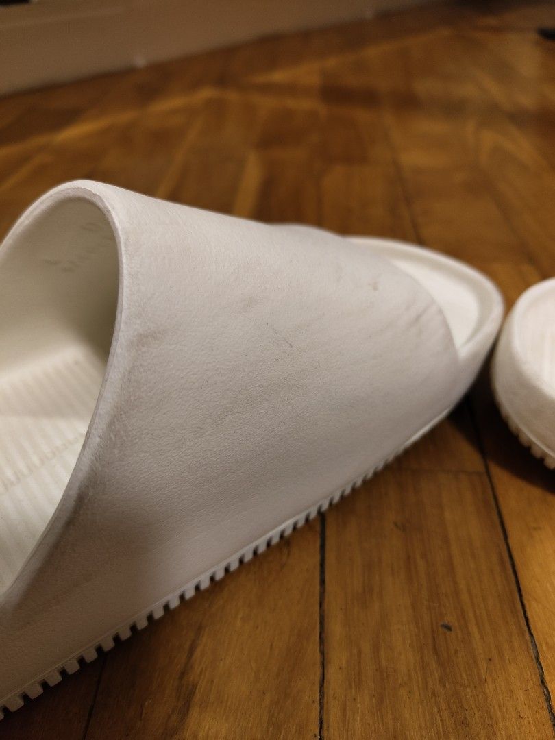 Authentic Nike Slides (Category: Slippers & Slides) located in Makati City. Submitted by kfcalderon926 (Listing ID 1460447537, Image 3). Description: seldom used authentic Nike Slides color: white has some dirt but no major flaws size: M 11 / W 12 Rfs: decluttering MOP: BPI/Gcash/ Gotyme delivery: via Grab or Lalamove ONLY. sf c/o. buyer Location: Makati.