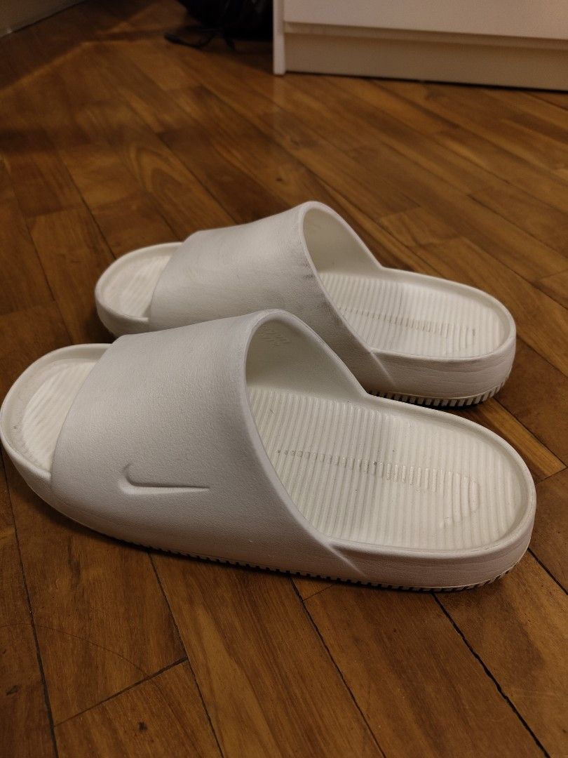 Authentic Nike Slides (Category: Slippers & Slides) located in Makati City. Submitted by kfcalderon926 (Listing ID 1460447537, Image 1). Description: seldom used authentic Nike Slides color: white has some dirt but no major flaws size: M 11 / W 12 Rfs: decluttering MOP: BPI/Gcash/ Gotyme delivery: via Grab or Lalamove ONLY. sf c/o. buyer Location: Makati.