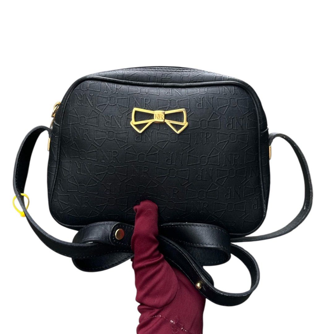 Authentic NINA RICCI (Category: Cross-body Bags) located in San Fabian. Submitted by rei_aniels (Listing ID 1460505351, Image 3). Description: Authentic NINA RICCI Like new Black Adjustable Strap .