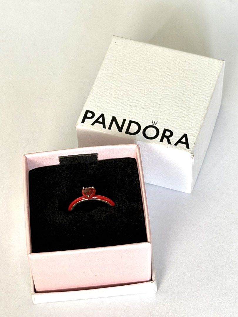 [AUTHENTIC] Pandora Chakra Red Heart Ring (Category: Rings) located in Malabon City. Submitted by blush_pink (Listing ID 1460316069, Image 3). Description: • Pandora Chakra Ring in RED - size 4 • Bought from Pandora store in Megamall few months ago • RFS: Not my style, used only once or twice. Been in box since • Original price was 3,450, selling for only 2,000.