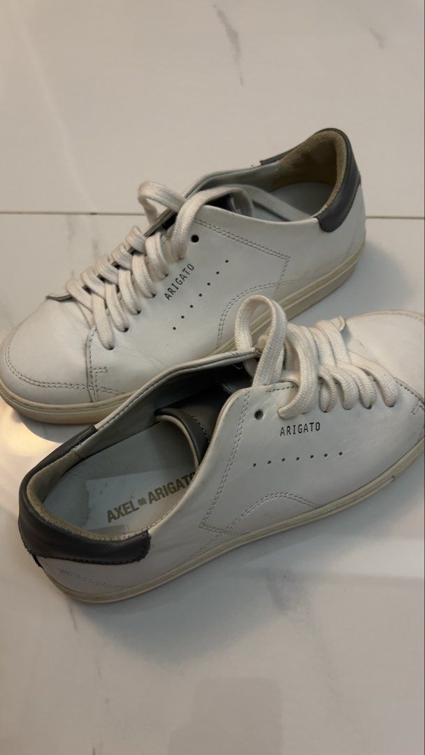 Axel Arigato White Leather Sneakers (Category: Sneakers) located in Marikina City. Submitted by clutters.of.a (Listing ID 1460430878, Image 1). Description: - Brand: Axel Arigato - Bought in Uptown for ₱13,000 - Style: Classic low-top sneakers - Material: White Leather - Origin: Made in Portugal - Used less than 5 times lang.