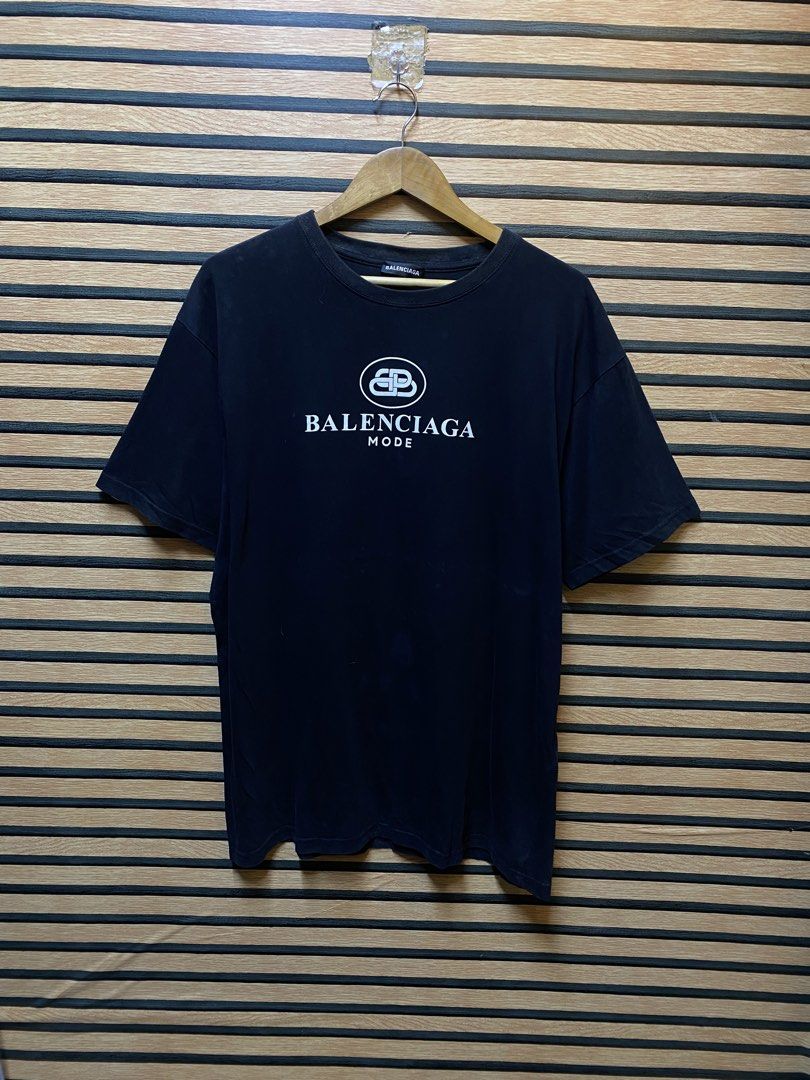 Balenciaga “BB Mode” T (Category: Tshirts & Polo Shirts ) located in Makati City. Submitted by drip.poww (Listing ID 1460433156, Image 1). Description: - Authentic Balenciaga - Color: Black - Size: XL - Dimes: 25x30 - Authentic - Excellent condition - Need wash, fresh from bale - Material: 100% Cotton Please don’t expect too much—these are thrifted (ukay) items. 😊 !!STILL NEGOTIABLE!!.