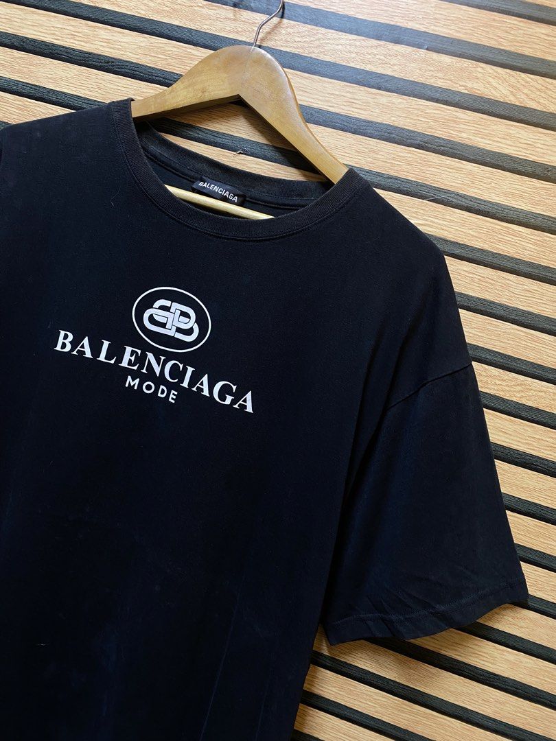 Balenciaga “BB Mode” T (Category: Tshirts & Polo Shirts ) located in Makati City. Submitted by drip.poww (Listing ID 1460433156, Image 2). Description: - Authentic Balenciaga - Color: Black - Size: XL - Dimes: 25x30 - Authentic - Excellent condition - Need wash, fresh from bale - Material: 100% Cotton Please don’t expect too much—these are thrifted (ukay) items. 😊 !!STILL NEGOTIABLE!!.